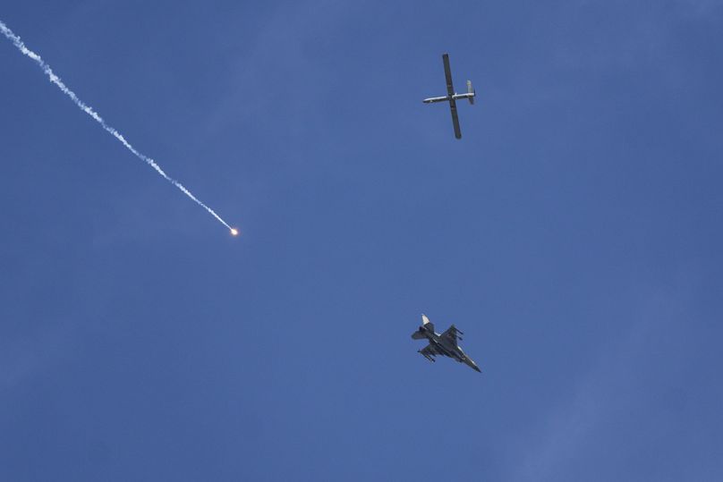 An Israeli fighter jet and a drone seen from Rafah, Gaza Strip.
