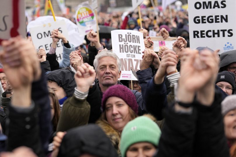 People protest in front of the Reichstag holding signs reading 'Bjoern Hoecke is a Nazi' at a demonstration against the AfD and right-wing extremism in Berlin, 3 February 2024