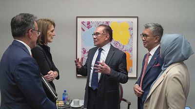 Malaysian Prime Minister Anwar Ibrahim, center, talks with Ruth Porat, second left, Alphabet Inc.'s president and chief financial officer, in New York, NY.