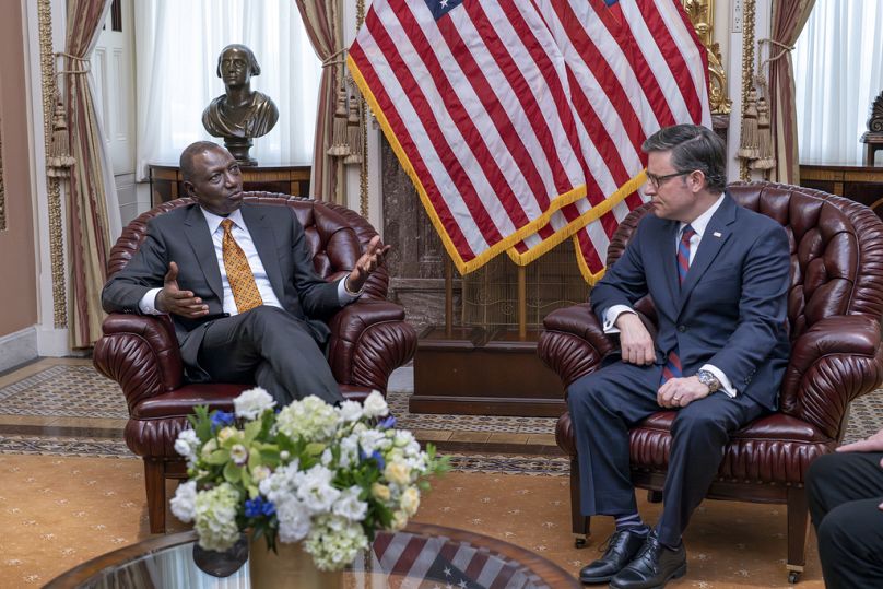 Kenya's President William Ruto, left, talks with Speaker of the House Mike Johnson, R-La., right, during a meeting as part of his state visit, at the Capitol in Washington, We