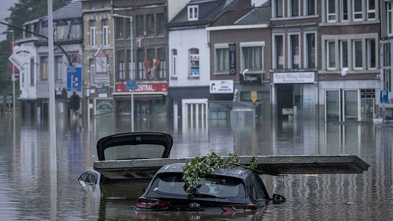 Cars submerged in floodwaters after the Meuse River broke its banks during heavy flooding in Liege, Belgium, 15 July, 2021.