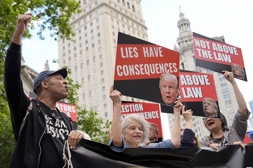 People react to the guilty verdict announced against former President Donald Trump outside Manhattan Criminal Court, May 30, 2024