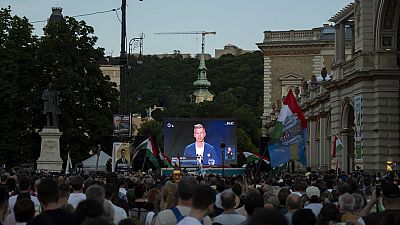 People listen to the speech of Peter Magyar during the debate in Budapest, Thursday May 30, 2024, ahead of the European Parliament elections,