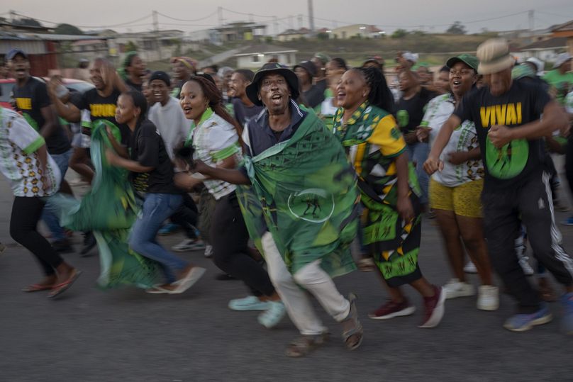 MK Party supporters celebrate in the middle of the street in Mahlbnathini village in rural KwaZulu-Natal, South Africa, on Thursday May 30, 2024. 