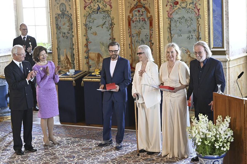 ABBA with Sweden's King Carl Gustaf and Queen Silvia at a ceremony at Stockholm Royal Palace on May 31