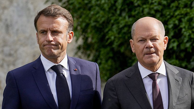 France's Emmanuel Macron is supportive of the EU probe while Germany's Olaf Scholz has cautioned against tarifffs.