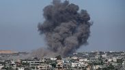 Smoke rises following an Israeli airstrike in Rafah, Gaza Strip.