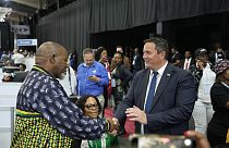 Leader of the main opposition Democratic Alliance John Steenhuisen, right, shakes hands with ANC's Chairman. Gwede Mantashe, left