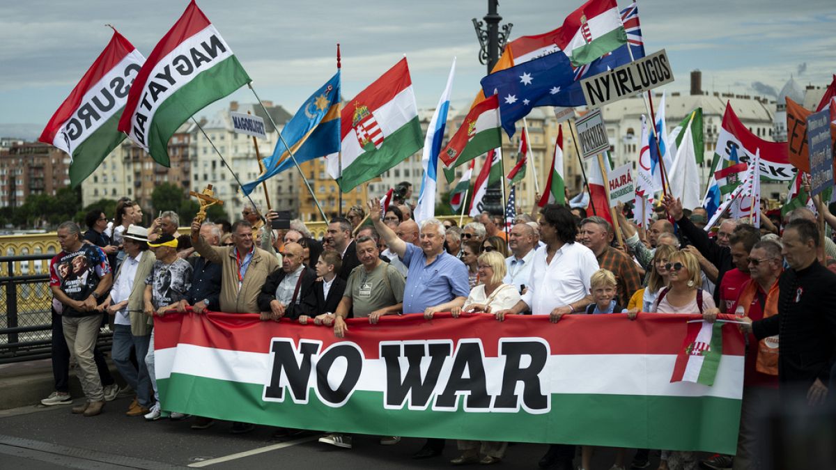 People march during a rally in support of Hungary's Prime Minister Viktor Orbán and his party in Budapest, Hungary on Saturday, June 1, 2024. (AP Photo/Denes Erdos)