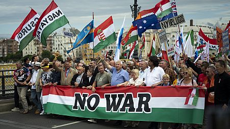 People march during a rally in support of Hungary's Prime Minister Viktor Orbán and his party in Budapest, Hungary on Saturday, June 1, 2024. (AP Photo/Denes Erdos)