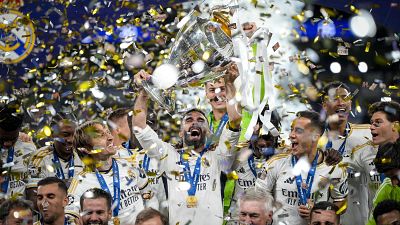 Real Madrid's players celebrate with the trophy after winning the Champions League final at Wembley, June 1, 2024