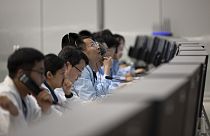 Technical personnel work at the Beijing Aerospace Control Center (BACC) in Beijing on Sunday as the craft lands on the moon