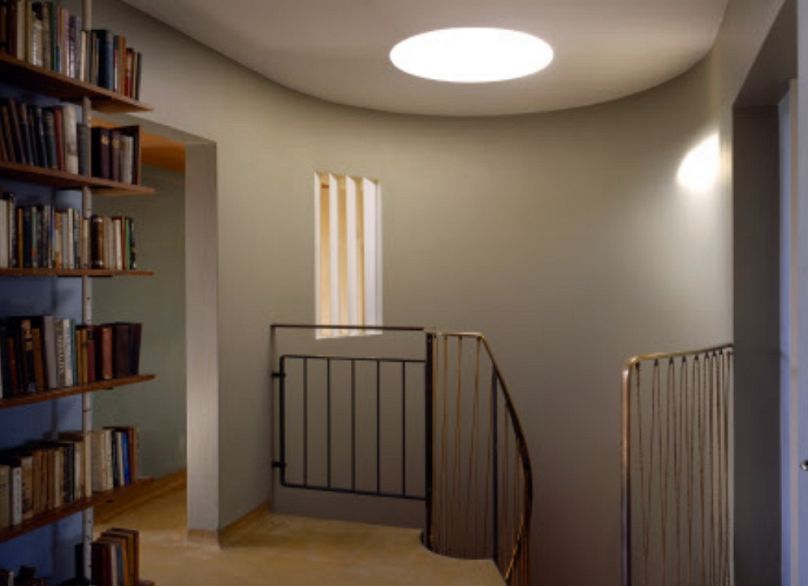 The light from the upper floor illuminates the interior