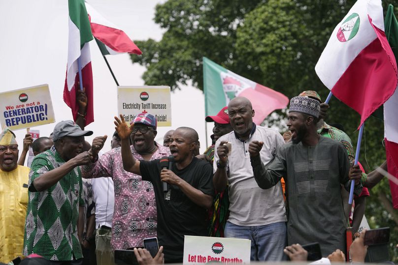 Joe Ajaero, centre, Nigerian Labor Congress President, speaks during a protest against the recent increase in the electricity tariff, in Abuja Nigeria, Monday, May 13, 2024.