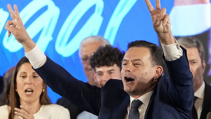 Luis Montenegro, leader of the center-right Democratic Alliance, gestures to supporters after claiming victory in Portugal's election