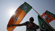 Bharatiya Janata Party supporters wave party flags at an election rally in Prayagraj, Uttar Pradesh, India, Tuesday, May 21, 2024. 
