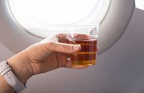 An alcoholic drink on a plane.