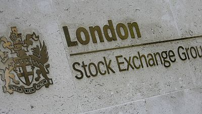 The logo and sign outside the headquarters of the London Stock Exchange seen in London, Friday, Jan. 22, 2010. 