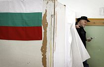 A Bulgarian walks out of a voting booth to cast his ballot for parliamentary elections in Sofia, Sunday, May 12, 2013 (AP Photo/Valentina Petrova)