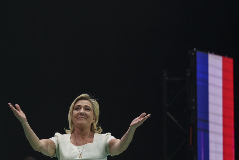 French far-right National Rally party leader Marine Le Pen gestures as she delivers a speech on stage during the Spanish far-right wing party Vox's rally "Europa Viva 24" in M