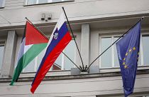 A Palestinian flag flies next to a Slovenian, center, and a European Union flag, right, at the government building in Ljubljana, Slovenia, Thursday, May 30, 2024.