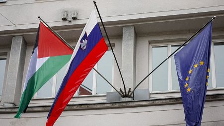 A Palestinian flag flies next to a Slovenian, center, and a European Union flag, right, at the government building in Ljubljana, Slovenia, Thursday, May 30, 2024.