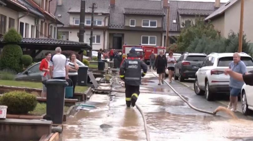 Firefighters pump out excess water in Slovakian village.