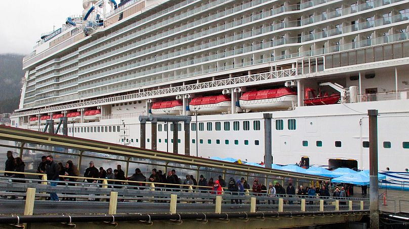 Passengers stream off the Norwegian Bliss after the vessel arrived in Juneau, Alaska, April 2022. 