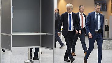 Anti-islam lawmaker Geert Wilders of the PVV, or Party for Freedom, is surrounded by body guards as he arrives to cast his ballot for the European election in The Hague, NL.
