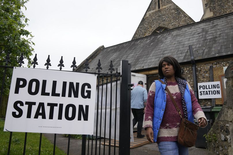 A woman leaves a polling station after voting to vote in London, Thursday, 2 May 2024.