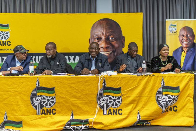 South African président Cyril Ramaphosa, center, meets with senior officials of his African National Congress party during the ANC's National Executive Committee Thursday, Jun