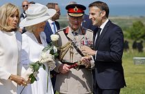  French President's wife Brigitte Macron, Britain's Queen Camilla, BritainKing Charles III and French President Emmanuel Macron discuss during the 80th D-Day anniversary