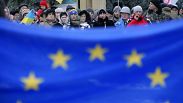 Pro-European Union activists carry a big EU flag as they march against the government in Kyiv, 17 December 2013