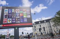 Bicyclists pass a billboard for the European Election outside the Maritime Museum in Amsterdam, the Netherlands, Wednesday, June 5, 2024.