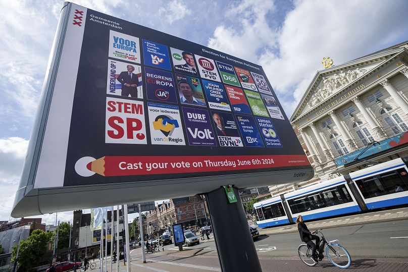 A bicyclist passes a billboard for the European Election opposite the Concertgebouw concert hall in Amsterdam, June 5, 2024