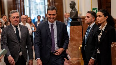 Spain's Prime Minister Pedro Sanchez, center, arrives at the Spanish parliament's lower house in Madrid on Thursday, May 30, 2024. 