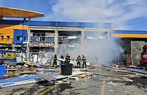 Romanian Emergency Services (ISU Botosani), firefighters work at the scene of an explosion at a chain DIY store in Botosani, Romania, Friday, June 7, 2024