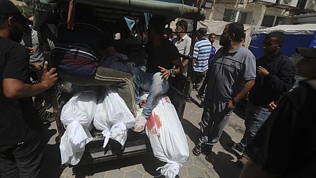 Palestinians killed in the Israeli bombardment of the Gaza Strip are brought to al-Aqsa Hospital in Deir al-Balah, central Gaza Strip, Saturday, June 8, 2024.