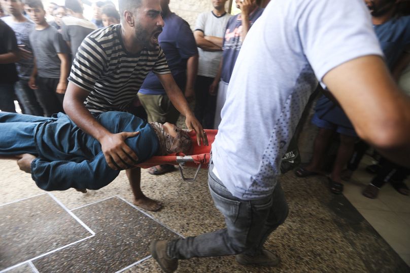 Palestinians wounded in the Israeli bombardment of the Gaza Strip arrive at al-Aqsa Hospital in Deir al-Balah, central Gaza Strip, Saturday, June 8, 2024. 