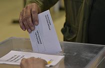 A voter casts his ballot at a polling station in Pamplona, 9 June 2024