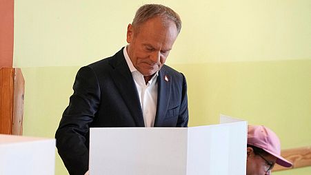 Polish Prime Minister Donald Tusk, who leads a centrist, pro-EU party, votes in the election for the European Parliament, in Warsaw, Poland, on Sunday, June 9, 2024.