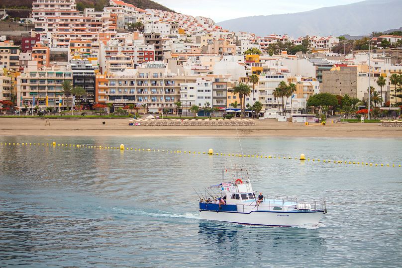 A boat sails out from Los Cristianos, Tenerife, Spain.