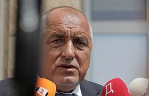 Bulgarian former Prime Minister Boyko Borissov talks to media after casting his vote at a polling station in Bankya, Sunday, June 9, 2024. 