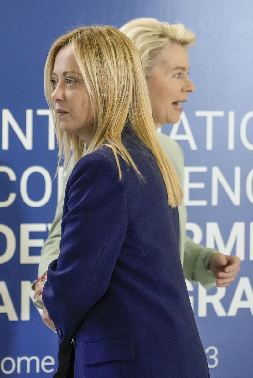 Italian Premier Giorgia Meloni, left, welcomes European Commission President Ursula von der Leyen as she arrives to attend an International conference on migration in Rome