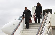 Malawi Vice President Saulos Chilima,left, and his wife Mary disembark from a plane upon his return from South Korea in Lillongwe, Sunday, June 9, 2024. 