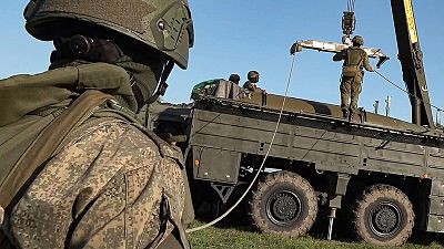 Russian troops prepare a missile launcher for joint Russian-Belarusian drills intended to train the military to use tactical nuclear weapons, 10 June 2024