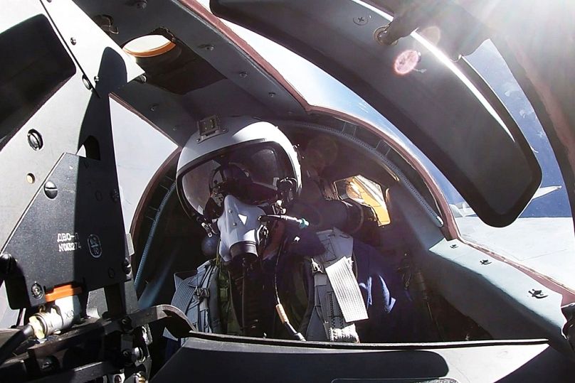 A pilot sits in a cockpit of a MiG-31 fighter jet during joint Russian-Belarusian drills intended to train the military to use tactical nuclear weapons, 10 June 2024