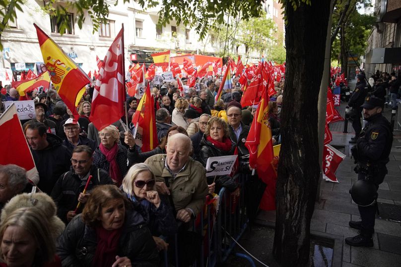 Supporters of Spain's prime minister Pedro Sanchez gather at the PSOE party headquarter during a demonstration in Madrid, Spain, Saturday, April 27, 2024.
