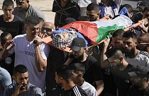 Palestinians carry the body of 15-year-old Mahmoud Ibrahim Nabrisi following an Israeli military raid in Al Fara'a refugee camp in the occupied West Bank, Monday, 10/06/24