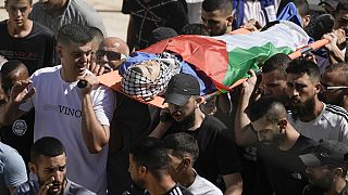 Palestinians carry the body of 15-year-old Mahmoud Ibrahim Nabrisi following an Israeli military raid in Al Fara'a refugee camp in the occupied West Bank, Monday, 10/06/24